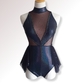 Navy blue peplum top with sheer overlay on a mannequin against a white background