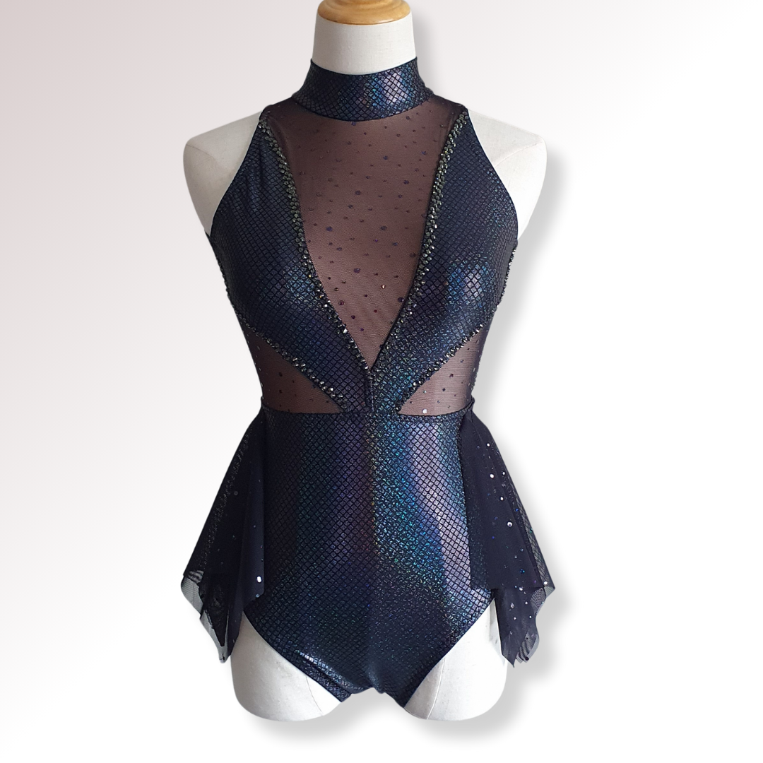 Navy blue peplum top with sheer overlay on a mannequin against a white background