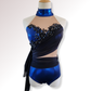 Blue and black dance costume on a mannequin with a white background