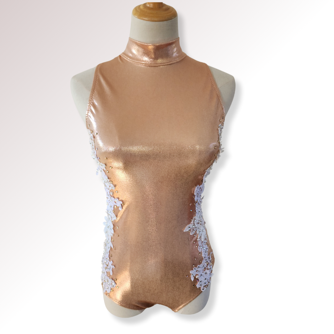 Mannequin wearing a metallic gold halter top with lace details on a white background