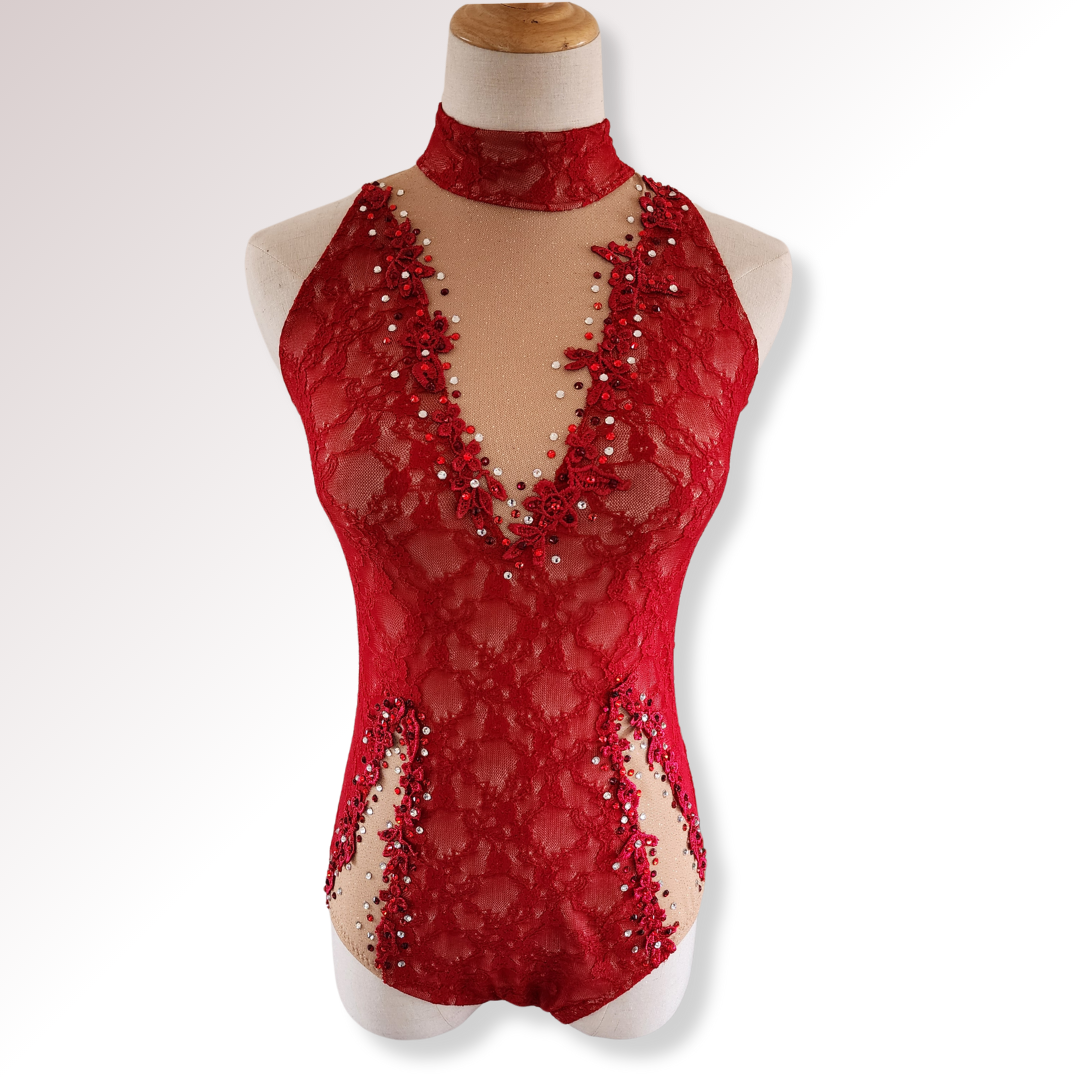 Red lace bodysuit with embellishments on a mannequin against a white background