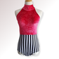 Red patterned top and black and white striped skirt on a mannequin against a white background